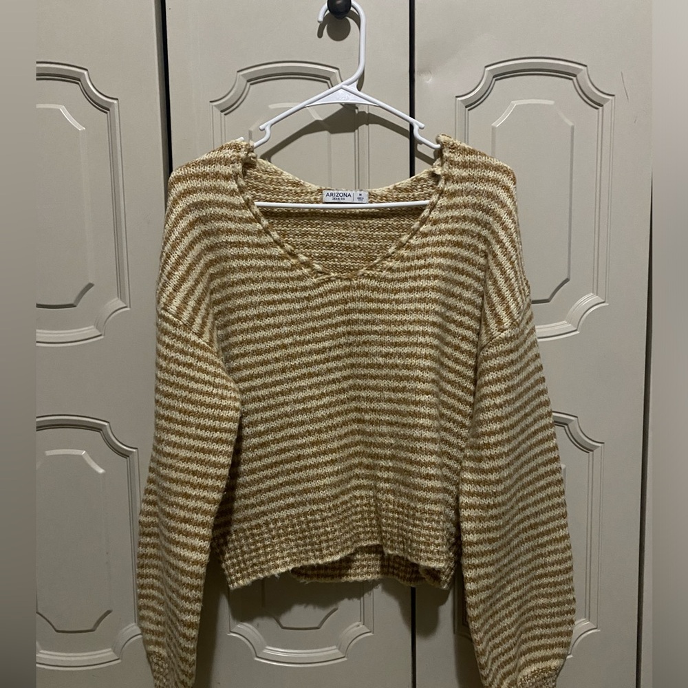 White and gold striped sweater